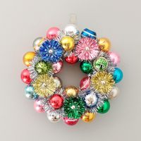 Oh so kitschy MCM vintage Christmas ornament wreath, completely decked out in a wide variety of bright colors, including pink, turquoise, purple, magenta, gold, yellow, green, red, silver & ice blue.   Most of the ornaments are all plain vintage balls, though you'll find a few stripes & stencils here and there. Shiny Brites far outnumber the others, but there are a few from Japan & Poland thrown into the mix. 5 vintage Merry Midget tinsel light reflectors, in pink, purple, green & gold, each wit