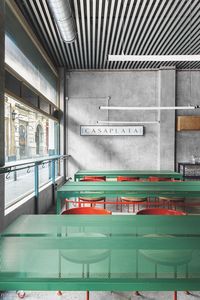 Casaplata restaurant by Lucas y Hernández-Gil. Rounded forms and a pastel upholstery palette juxtapose with such industrial, brutalist nods as unpolished concrete flooring and exposed pipes.