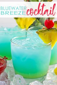 Bluewater Breeze Cocktail - An easy tropical-inspired cocktail with vodka, rum, blue curacao, cream of coconut and pineapple juice!