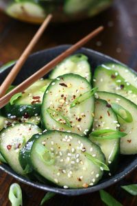 Asian Cucumber Salad is one of the easiest side dishes that is made with simple ingredients. This recipe comes together in under 10 minutes and is incredibly mouthwatering. One of the best salads to have on a hot summer evening.  #AsianCucumberSalad #AsianCucumberSaladRecipe #AsianCucumberSaladRecipeRiceVinegar #AsianCucumberSaladRecipeSesameOil #AsianCucumberSaladSoySauce