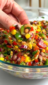 This easy recipe for Cowboy Caviar is fun, fresh, colorful, and endlessly adaptable. It makes a great dip, salad, side dish, or even a topping for grilled meats. Always a potluck favorite!