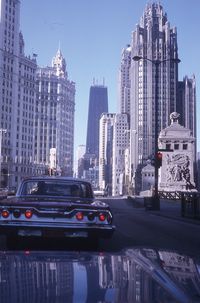 Chicago 1969 | Tribune Tower, Wrigley Building, John Hancock Center, and some vintage autos - March, 1969. Pinned by #CarltonInnMidway - www.carltoninnmidway.com