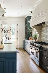 The entire cooking area is quite impressive….large windows with a very dramatic kitchen hood, incredible tile backsplash with a 48” BlueStar® Platinum Series range beneath it. “I love the old world feel of the backsplash and that it brought more color in…so much more than a subway tile or a chevron. The painted terra cotta has such a nice quality—it does not feel new,” said Swanson.