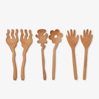 Designed by Selena Liu for Areaware, Serving Friends are Sapele wooden spoons carved into charming shapes that bring joy and humor to your dining table.