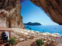 Capotaormina private hotel beach in Sicily, Italy. An amazing hotel built into the rock face with a series of underground caves, so beautiful.