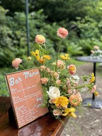 Small, whimsical bar moment in an airy wildflower aesthetic at Portico Awbury Arboretum!