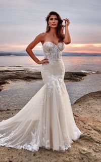 This mermaid wedding dress has timeless soft lace details and a trendy, sexy sheer corset bodice. It's long lace train is just the right amount of drama. This dress is literally perfect for you. Try it on at Laura & Leigh Bridal!