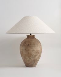 Available to ship mid to late November The Avianna Lamp exudes a neutral tan hue with subtle brown accents provides a serene backdrop, while intricate crack detailing embedded in the paint and texture of the vase adds depth and character. Specs Size: 26.7" W x 27.5" HWeight: 22 lbs