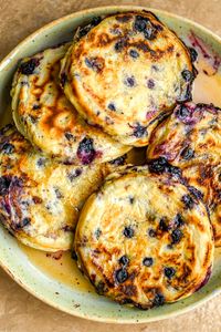 Start your mornings right with these delicious Vegan Blueberry Buttermilk Pancakes! 💙🥞 Whip them up in just 10 minutes and savour the sweet blueberry swirls. Perfect for vegans, dairy-free lovers, or anyone craving a quick, easy breakfast idea. Save this recipe now! 📌