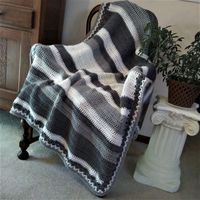 The Boyfriend Blanket is a crochet pattern to make this generous size blanket (54" x 86" can be custom sized) which offers random width panels in a random color sequence using only double crochet stitches in the main body. It features two tones of blue accented by white.  2 other versions are provided, a smaller grey tone blanket 42.5" x 57.5" and one featuring a more traditional striping pattern 56" x 92". Pick colors to match your decor, favorite sports team or school. Difficulty Level ~ Begin