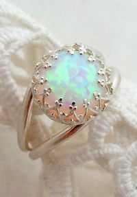 This looks eerily similar, especially the crown like setting, to an opal ring that I had made for myself (from pieces that I handpicked, including the opal!) by a really kind jeweler when I was about eighteen years old and living in Saint Petersburg, FL, with my (now) ex-husband. Oh, memories... I wish I had never lost that pretty little ring!