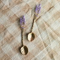 Hand-cast in pewter with an antiqued bronze finish, these delicate spoons from Michael Michaud take the shape of fresh lavender sprigs.