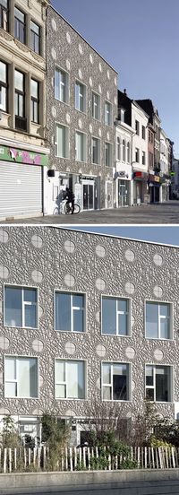 This building facade is covered in decorative panels made from concrete