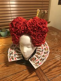 The red queen from Alice in wonderland rose hair piece and card collar. Halloween costumes.