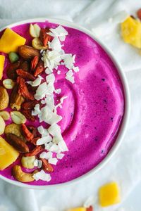 Healthy (vegan, gluten free and paleo), this pitaya power smoothie bowl is an easy breakfast recipe. It's filled with super foods like dragon fruit and blends together in minutes. Add frozen pitaya, strawberries and bananas to a bowl with almond milk and blend on high. Add your favorite healthy toppings like nuts and seeds. You can even add protein powder!