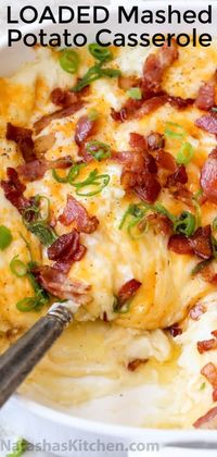 Loaded Mashed Potato Casserole is the perfect side dish. These irresistibly creamy baked mashed potatoes are loaded with cheese and topped with crispy bacon. #loadedpotatoes #loadedbakedpotatoes #potatocasserole #loadedmashedpotatoes #potatoes #natashaskitchen