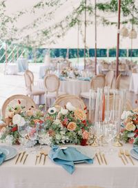 Fall Floral Centerpieces with Pops of Blue Linen Napkins Under a Sailcloth Tent with Hanging Greenery at this Italian Inspired Wedding on the Chesapeake | Destination Wedding Planning, Design, & Florals by Rebecca Rose Events | Summer Wedding | Annapolis Wedding | Photography by Corbin Gurkin | As Seen on Carats & Cake