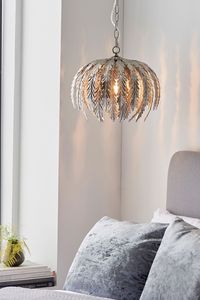 An opulent and ornate silver leaf finished floral pendant light, formed from long floral leaves and suspended from height adjustable chain. Add some gold glamour to your interior, perfect when paired with LED filament lamps to create striking light patterns. This product is dimmable. 100% Steel.