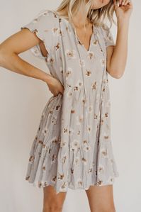 This dress has us counting down the days until Spring! We love the easy fit, lovely grey lilac color and subtle floral pattern. Pair with a denim jacket and some white tennies for a casual look or dress it up with some slides, heels and a hat! Either way, we just know you will feel so beautiful in the Raelynn!