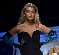 Posh hair: Gigi Hadid nailed Moschino’s 1980s mega-volume hair which was a melting pot of power, gel and cash.