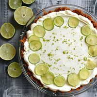 Enjoy this pairing of bright lime and cream cheese filling with zesty gingersnap crust in a no-bake cheesecake pie that will be a welcome dessert on your table!