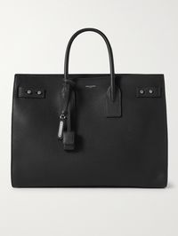 Introduced in 2013, SAINT LAURENT's 'Sac de Jour' is a core style for the French house. This large version has been crafted in Italy from black full-grain leather that will become less rigid over time and take on a more relaxed silhouette. The nubuck-lined interior is fitted with a handy removable zipped pouch, perfect for keeping smaller items safe and separated.