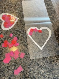 Fun kid Valentine activity craft! Cut out a heart with paper and using a laminating sheet, place cut up tissue paper squares in the middle of the heart. Laminate and hang on the window!