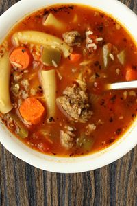 Instant Pot Santa's Soup--a hearty red and green soup to keep the big fella going all season long! This soup has a delicious broth, Italian sausage, pasta and vegetables. 