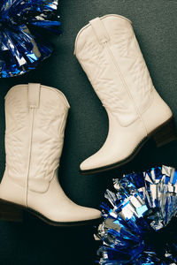 Halloween with Steve Madden's stunning collection of boots, perfect for elevating your aesthetic this spooky season. From edgy, platform combat styles to chic knee-high stilettos in black, white, denim blue or burgundy red these silhouettes effortlessly complement any costume idea. Channeling a sexy astronaut, a western cowgirl, dallas cheerleader, something Wicked, scream, a last minute cat outfit or a silly funny hot hotdog? Shoes for any look! Don't forget your vampire handbag or skull purse.