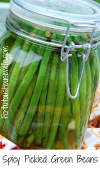 Spicy Pickled Green Beans: 1# green beans, trimmed, 3 cups white vinegar, 4 cloves of garlic, thinly sliced, 2 Tbs coarse salt, 1 Tbs black pepper corns, 2 tsp sugar, 2 dried red chilies (or substitute 1/4 - 1/2 tsp red pepper flakes. Adjust peppers to your taste). Directions: Put green beans and garlic in a clean jar. In a saucepan, bring remaining ingredients to a boil. Pour liquid into jar, seal closed and let cool to room temperature before refrigerating.