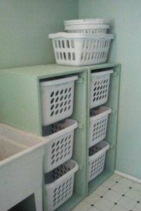 A way to keep laundry organized and off the ground. I HAVE USED THIS METHOD IN A FLOOR TO CEILING CABINET, OPEN FACED, WITH ADJUSTABLE SHELVES TO HOLD LAUNDRY BASKETS, DOG TOWELS, MISC. SUPPLIES.