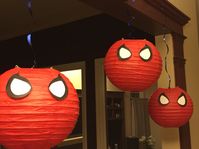 DIY Spiderman paper lanterns. Start with red paper lanterns in a variety of sizes at http://www.partylights.com/Lanterns/Cinnabar