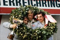 1973 Austrian Grand Prix. Osterreichring, Zeltweg, Austria. 17-19th October 1973. Ronnie Peterson, Lotus, 1st position, with Jackie Stewart, Tyrrell, 2nd position and Carlos Pace, Surtees, 3rd position, on the podium.