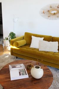 The Sven’s gone gold. We’ve updated our most popular sofa in luxe ochre velvet for maximum mid-century appeal. Photo by @orb.interiors: aesthetic, home mood board, warm home aesthetic, apartment inspiration, apartment inspo, apartment aesthetic cozy, living room sofa, earthy living room, colorful mid century modern living room, cozy mid century modern living room