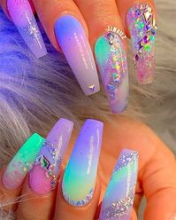 Looking for nails that stand out from the crowd? In that case you need to check these wow-worthy unicorn nail designs! unicorn nail designs | trending nail designs | mermaid nails | unicorn nails | nail art trends | 2023 nail ideas | nail ideas | coffin nail ideas | almond nail ideas | stiletto nail ideas | acrylic nail designs