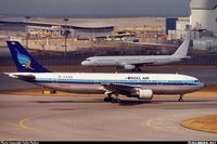 The last photo I ever got of Angel Airlines before they went bankrupt. Note the Pacific Airlines A321 (Ex Myanmar Airways) in the background. - Photo taken at Hong Kong - International (Chek Lap Kok) (HKG / VHHH) in Hong Kong, China in December, 2001.