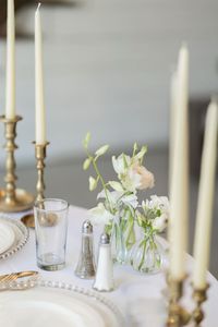 This reception!!!✨ The head tables were filled to the brim with candles and a few bud vases, and the other guest tables had a simpler version of this with centerpieces in gold vases for the rounds. We pivoted our design plan throughout this couples’ planning process to match their vintage-glam vibe and feature some of the brides favorite flowers, tulips. We opted for a mix of textured and clear glass bud vases, and some of our antique gold compotes to tie into the gold accents. 💫 Because I’...