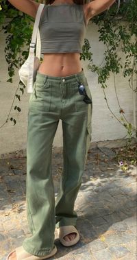 Grey washed tol with green baggy cargo pants and white purse