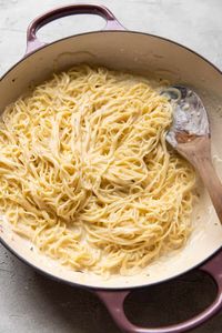 This easy creamy angel hair pasta will become a family side dish favorite! You will love how rich and creamy the pasta is and it takes less than 30 minutes to prepare.