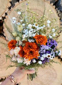 "Dried Flower Bouquet, Boutonniere, Bridal Bouquet, Wedding Bouquet, Dry Flowers May vary slightly in size:    Bouquet:       9\" wide x 14\" long x 6\" deep Boutonniere:      2\" wide x 4\" long x 1.5\" deep Dried Flowers and Country Weddings go Together! This listing is for our Orange and Purple Bouquet or Boutonniere. The bouquet is made with fragrant preserved sweet annie, marigolds, nigella pods, flax, wheat, everlasting wings and strawflowers.  For a Touch of Country Charm, we tie it toget