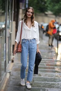 Tilda showing off her classic beauty in high waisted denim and a white blouse. Paris #TildaLindstam #Offduty