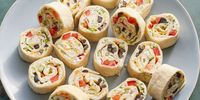 These savory pinwheel sandwiches are made with large tortillas filled with homemade veggie cream cheese, rolled and sliced into small party bites.