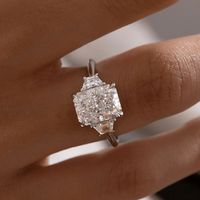 3 Ct Radiant Cut Moissanite Engagement Ring, Crushed Ice Radiant Cut Ring, Elongated Radiant, Three Stone Ring ✥ 𝐌𝐚𝐢𝐧 𝐒𝐭𝐨𝐧𝐞 𝐃𝐞𝐭𝐚𝐢𝐥𝐬 ↣ Shape: Radiant Cut ↣ Type: Moissanite ↣ Weight: 3 Ct (App.) (9.5x7mm) ↣ Color: Colorless ↣ Side Stone: Moissanite ↣ Clarity: VVS ↣ Making Process: Handmade - Crafted by our experienced team ✥ 𝐑𝐢𝐧𝐠 𝐃𝐞𝐭𝐚𝐢𝐥𝐬 ↣ Band Width: 1.8 mm (± 0.10) [Customization Possible] ↣ Metal Purity: Solid Gold (10KT, 14KT, 18KT); Silver (925 Sterling), 950 Plati