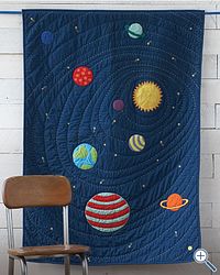 How awesome does this look!!  Solar System Quilt - looks a little tricky but not as time-consuming as hundreds of tiny pieces - sew planets and stars onto the blue base, then quilt in circles/a spiral.    Pinned for Kidfolio, the parenting mobile app that makes sharing a snap.