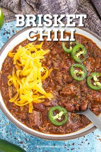 This brisket chili is bursting with fire-roasted tomatoes, a flavorful blend of spices, and tender chopped brisket, hearty comfort with every bite.