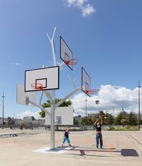 Multi-hoop basketball playing has been perfected by French architecture firm, a/LTA. Drawing design inspiration from trees, the aptly named, ‘Arbre à Basket’ (Basket Tree) is a unique urban park installation in Nantes, France. featuring five separate basketball hoops attached to branches connected to a tree-limb like post.