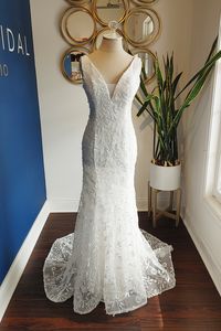 Sequined leafy lace fit and flare bridal gown with v-neck and back, available off the rack at Silk Bridal Studio