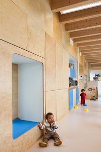 Daycare centre near Brussels features child-size furniture and a combined staircase and slide