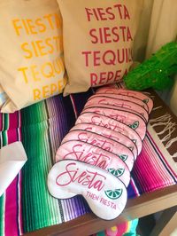 Can't fiesta till you siesta! Frozen or on the rocks, surprise your besties with the ultimate treat--- beauty rest, before you're poolside sipping margs! This sleep mask with cursive writing is the perfect gift for your BFF, your bachelorette group, bridesmaids, the day of getting ready for the wedding or just a fun present!Details: Adjustable head strap Design is as shown - Bright pink wording with green lime