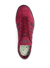 Tobacco Gruen low-top sneakers from adidas featuring maroon, calf suede, logo-print tongue, side stripe detailing, round toe, front lace-up fastening, branded insole and rubber outsole. This item is in size 11 and the color is Red